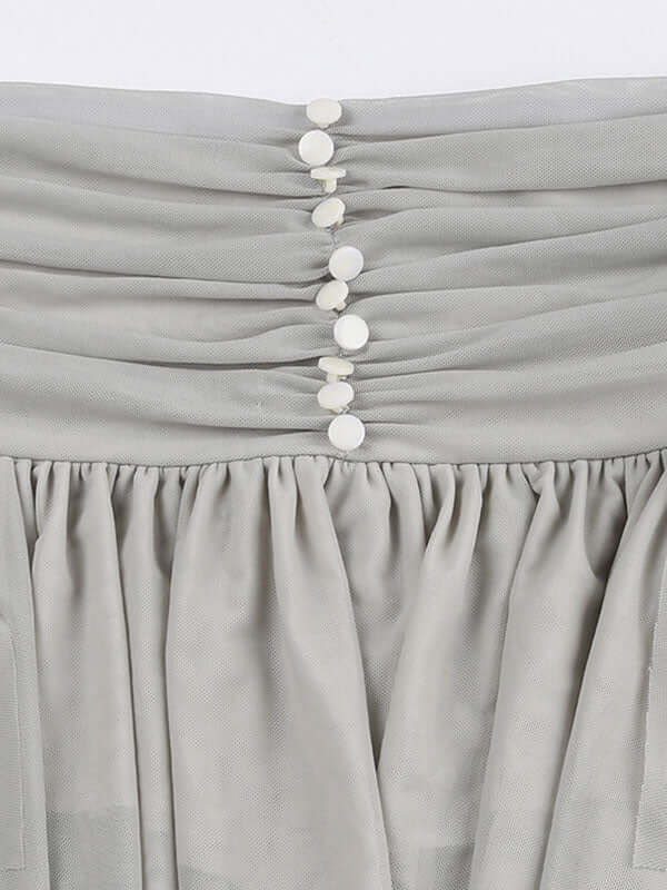 Asymmetric Hem Decorative Button Mini Skirt